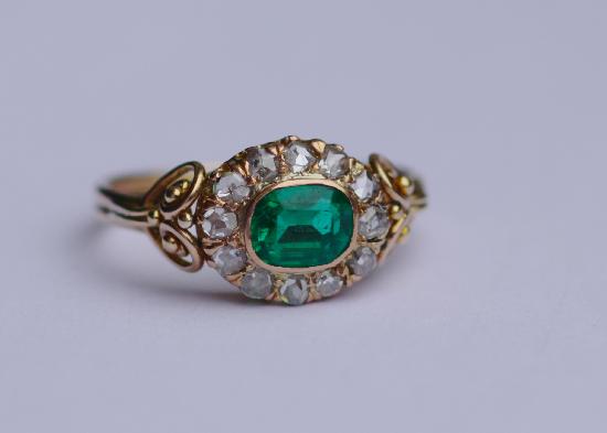 ANTIQUE EMERALD AND DIAMOND ENGAGEMENT RING.