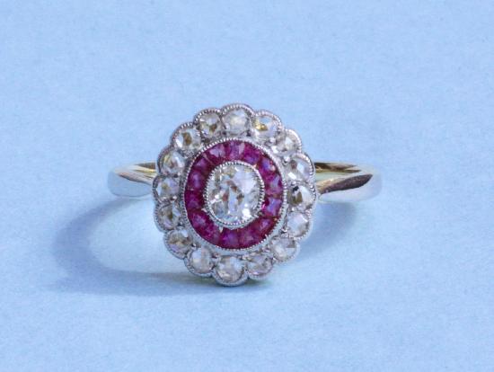 ART DECO RUBY AND DIAMOND TARGET ENGAGEMENT RING.