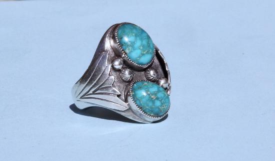 LARGE NAVARRO INDIAN SILVER AND TURQUOISE RING.
