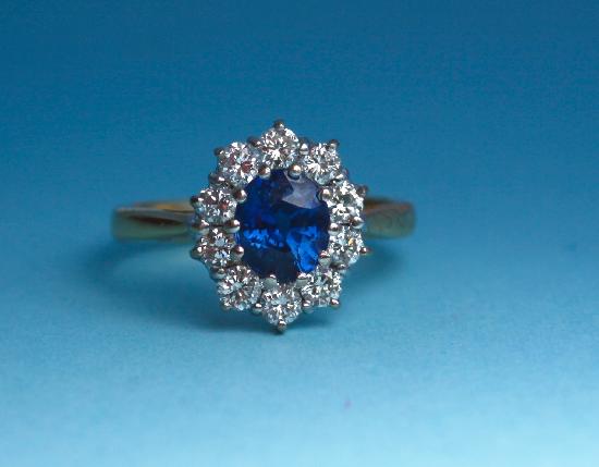 PRETTY SAPPHIRE AND DIAMOND CLUSTER ENGAGEMENT RING
