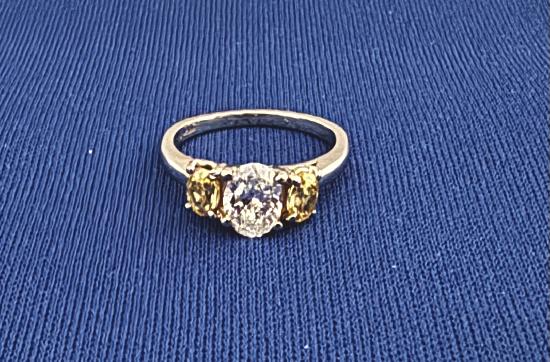 OVAL DIAMOND WITH FANCY YELLOW DIAMONDS.