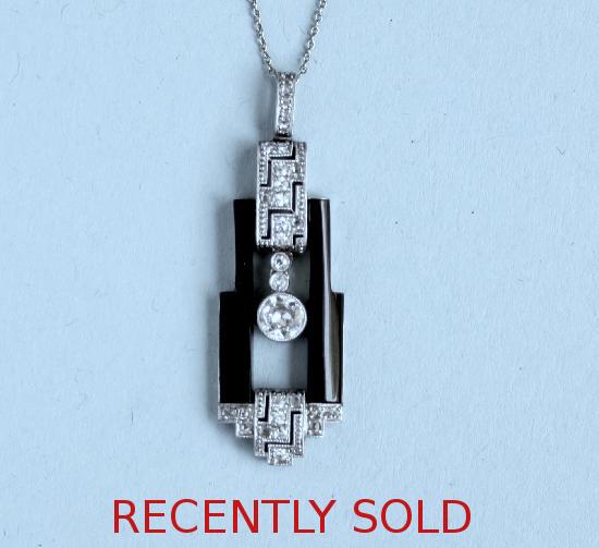 STYLISH ART DECO ONYX AND DIAMOND PENDANT