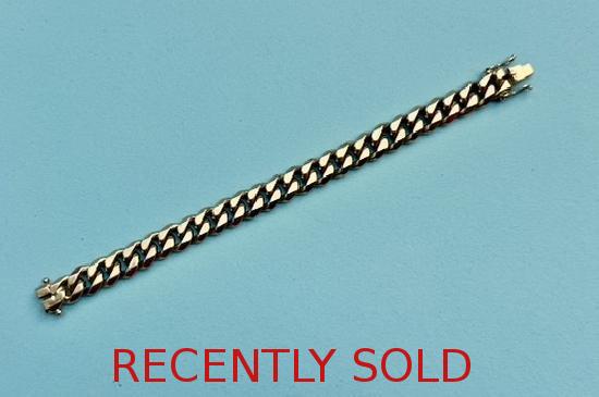 VERY HEAVY CURB LINK BRACELET.